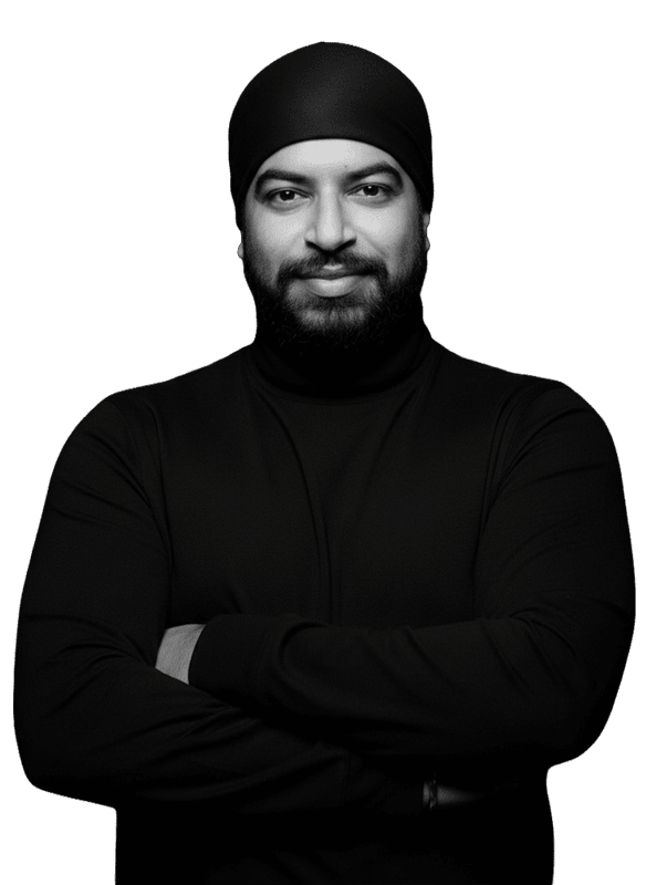 Modern man with beard in black clothing, arms crossed, confident pose, black background, professional portrait, Let's Get Property branding.
